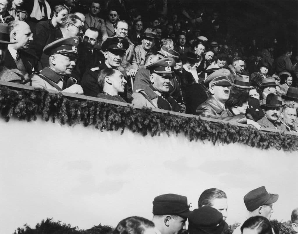 German Chancellor Adolf Hitler watches the final ski jumping contest in the Winter Olympics at Garmisch-Partenkirchen, Germany, February 1936. (Keystone/Hulton Archive/Getty Images)