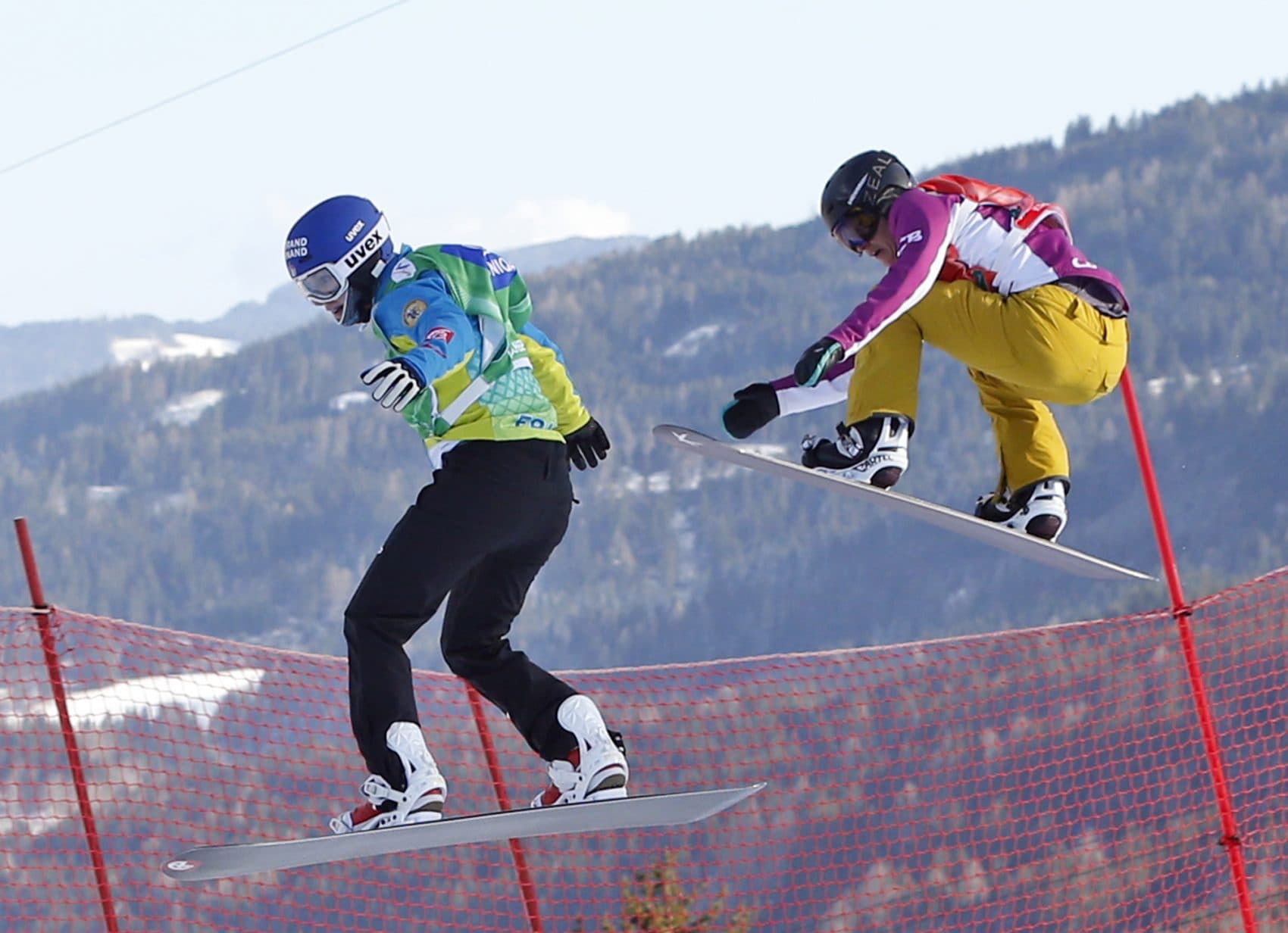 Lindsey Jacobellis, right, from the U.S. competes to win the snowboard cross event at the Freestyle Ski and Snowboard World Championships in Kreischberg, Austria, Friday, Jan. 16, 2015. (Darko Bandic/AP)