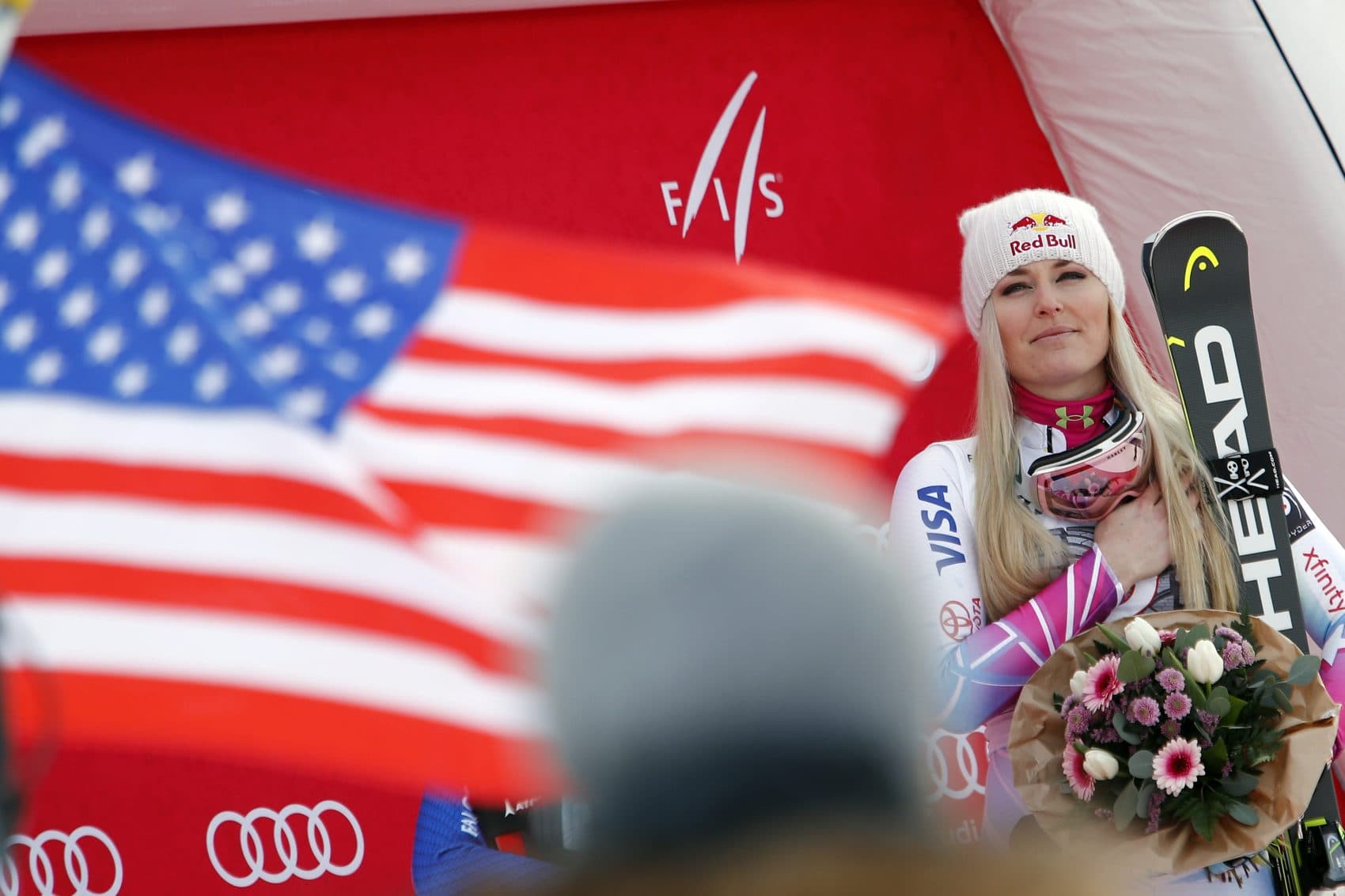 First placed United States' Lindsay Vonn listens to the national anthem at the end of an alpine ski, women's world Cup downhill race, in Garmisch Partenkirchen, Germany, Saturday Feb. 3, 2018. (Gabriele Facciotti/AP)