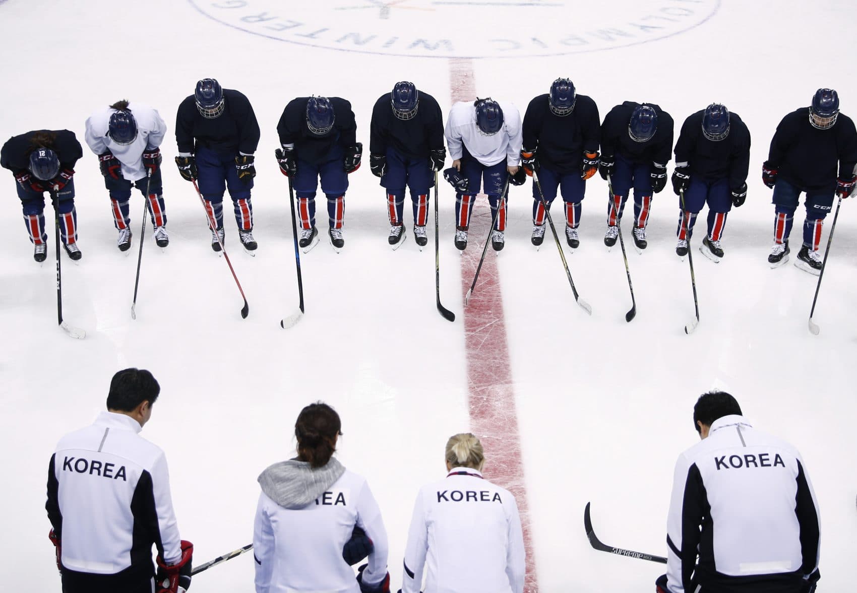 The combined Korean women's ice hockey players bow to their coaching staff after a practice session prior to the 2018 Winter Olympics in Gangneung, South Korea, Monday, Feb. 5, 2018. (Jae C. Hong/AP)