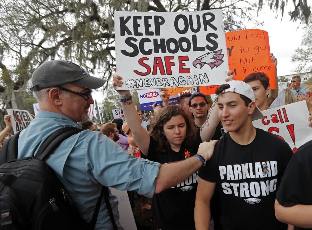 In this Feb. 21 file photo, student survivors from Marjory Stoneman Douglas High School are greeted as they arrive at a rally for gun control reform on the steps of the state capitol, in Tallahassee, Fla. (Gerald Herbert/AP)