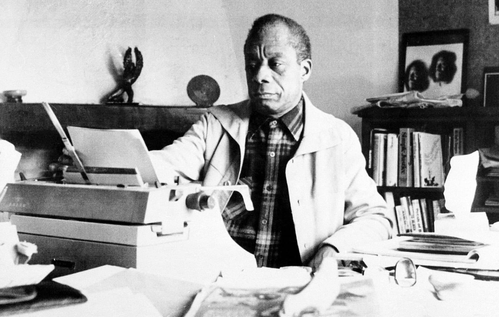 American novelist James Baldwin sits in front of his typewriter in the study of his home in St. Paul de Vence, in southern France, on March 21, 1983. (AP)