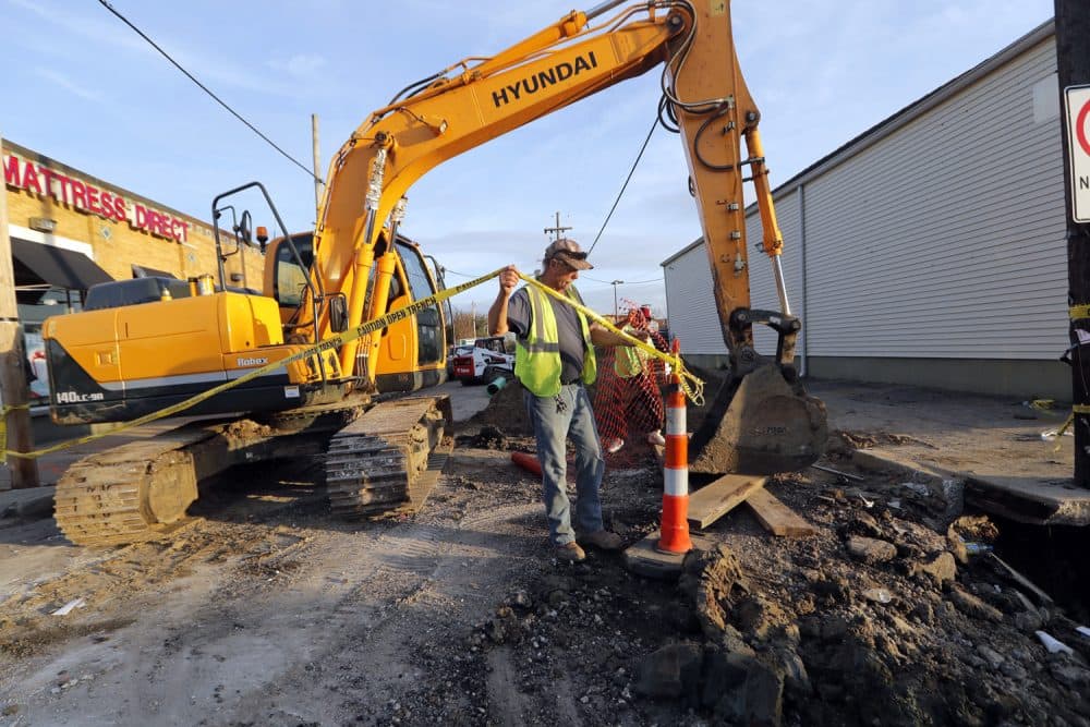 Workers fix a sewer main below the sidewalk in Mid City New Orleans, Wednesday, Jan. 31, 2018.  The city of New Orleans is perhaps one of the best examples of what President Donald Trump calls the countrys crumbling infrastructure. City officials say New Orleans needs more than $11 billion to update key parts of its infrastructure. The city has about $2 billion in hand, but its not clear that Trumps bold plan will help make up the gap. New Orleans mayor says Trumps proposal puts the onus on cities and states to raise taxes and fees to pay for the improvements. 
(AP Photo/Gerald Herbert)