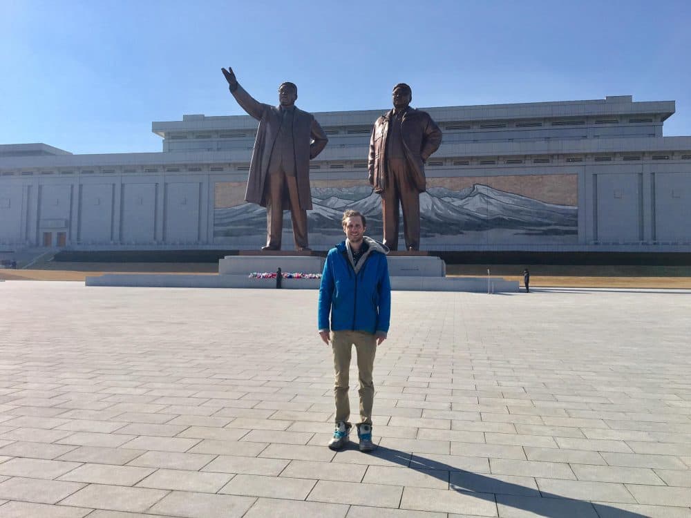 Alex stands in front of the statues of Kim ll-sung and Kim Jong-il at North Korea's Mansu Hill Grand Monument. (Courtesy Alex Frecon)