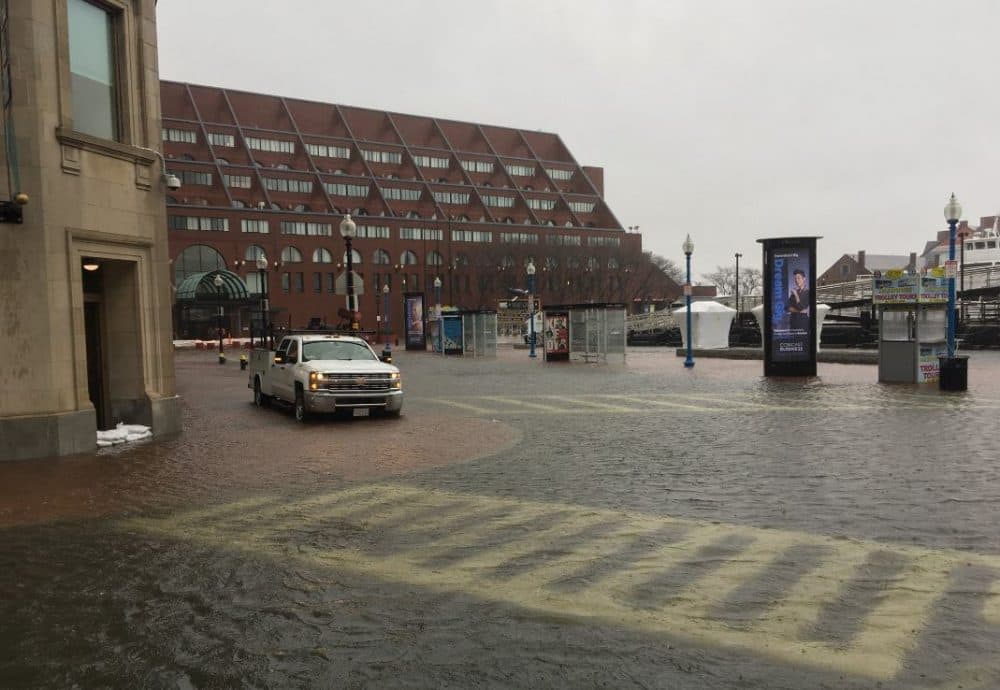 Flooding near the New England Aquarium in Boston. (Robin Lubbock/WBUR)