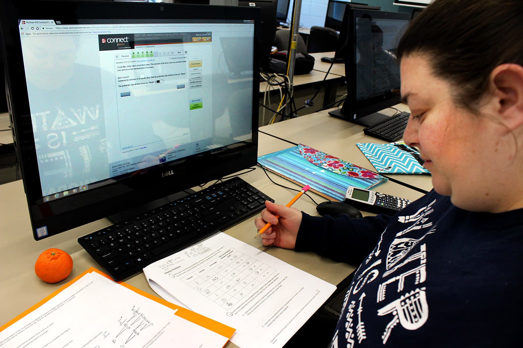 Christine Sifre works through probability equations in a statistics fusion course at Northern Essex Community College. (Carrie Jung/WBUR)