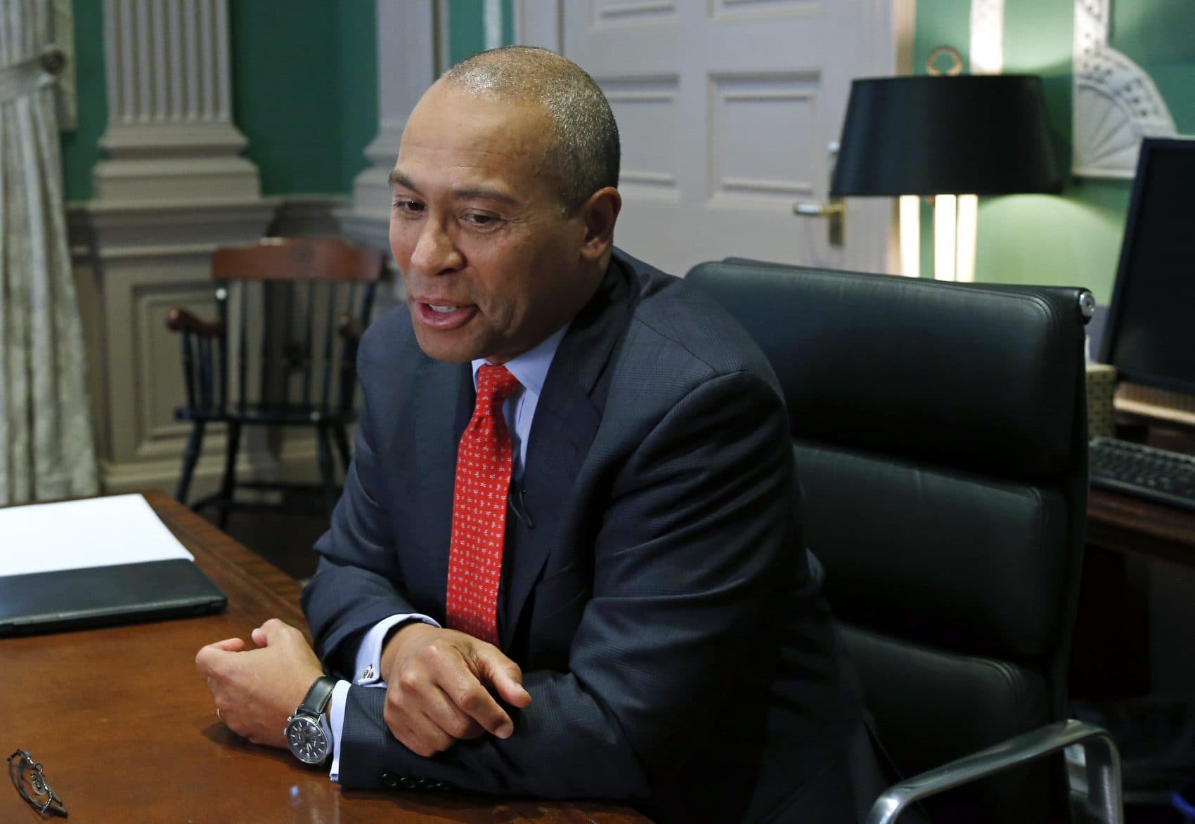 Former Massachusetts Gov. Deval Patrick speaks during an interview at his State House office in Boston in 2014. (Elise Amendola/AP)