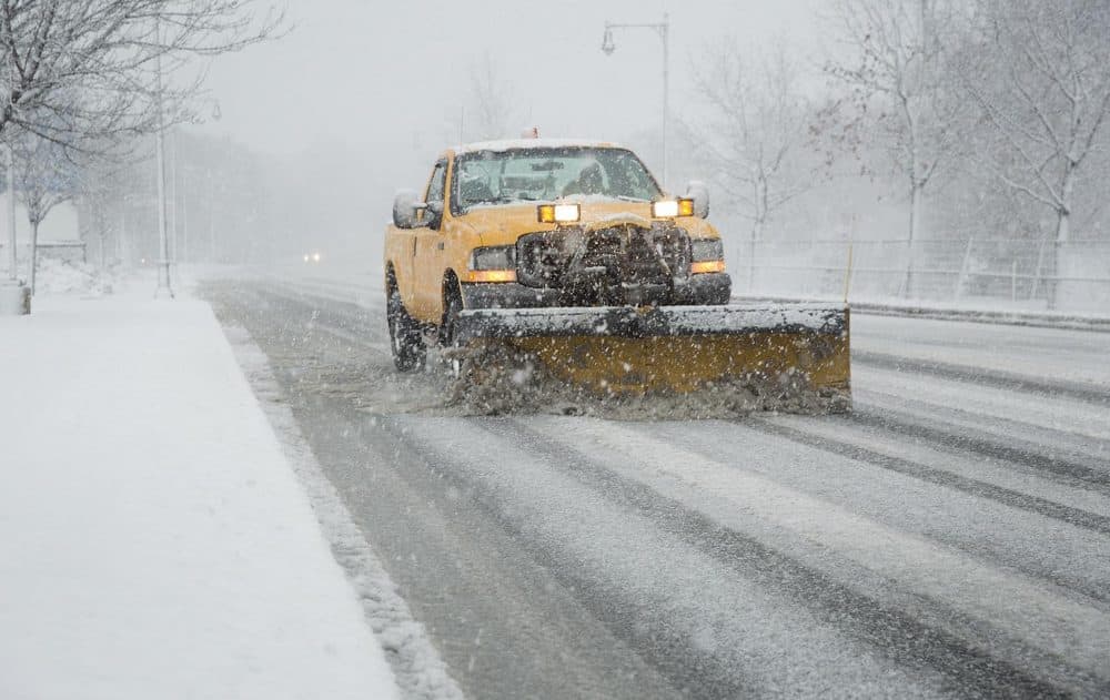 A snowplow clears a deserted Route 3 in Cambridge during Tuesday morning's commute. (Robin Lubbock/WBUR)