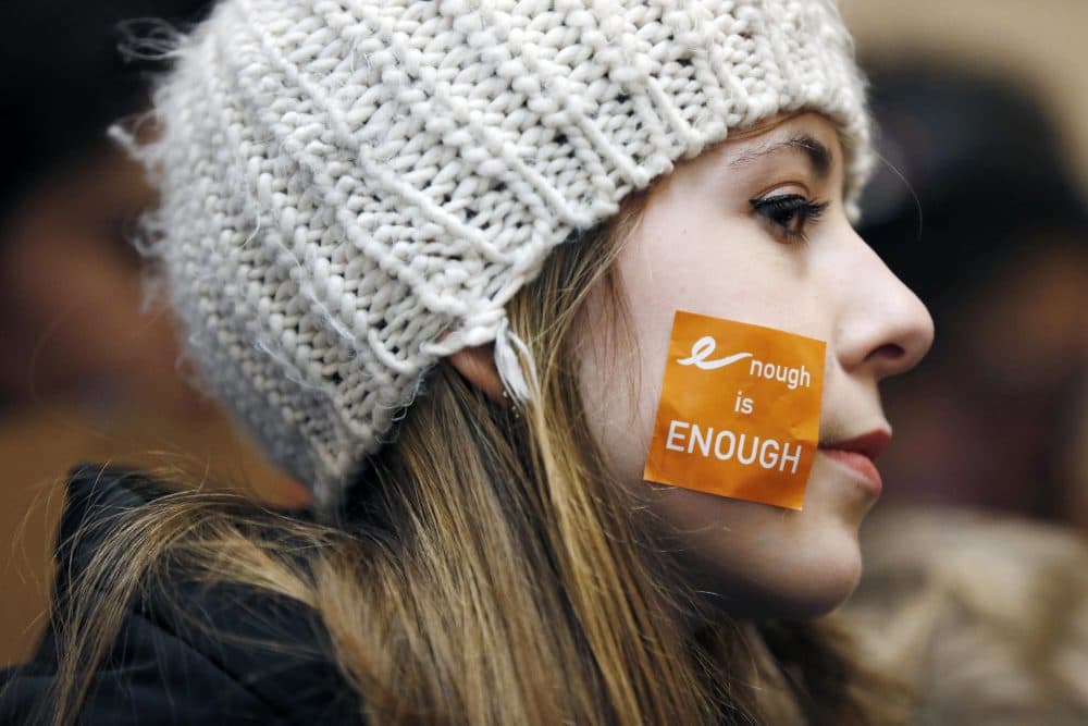 Helena Cameron, 15, of Medford, Mass., listens to speeches during a rally in St. Paul's Cathedral in Boston. (Michael Dwyer/AP)