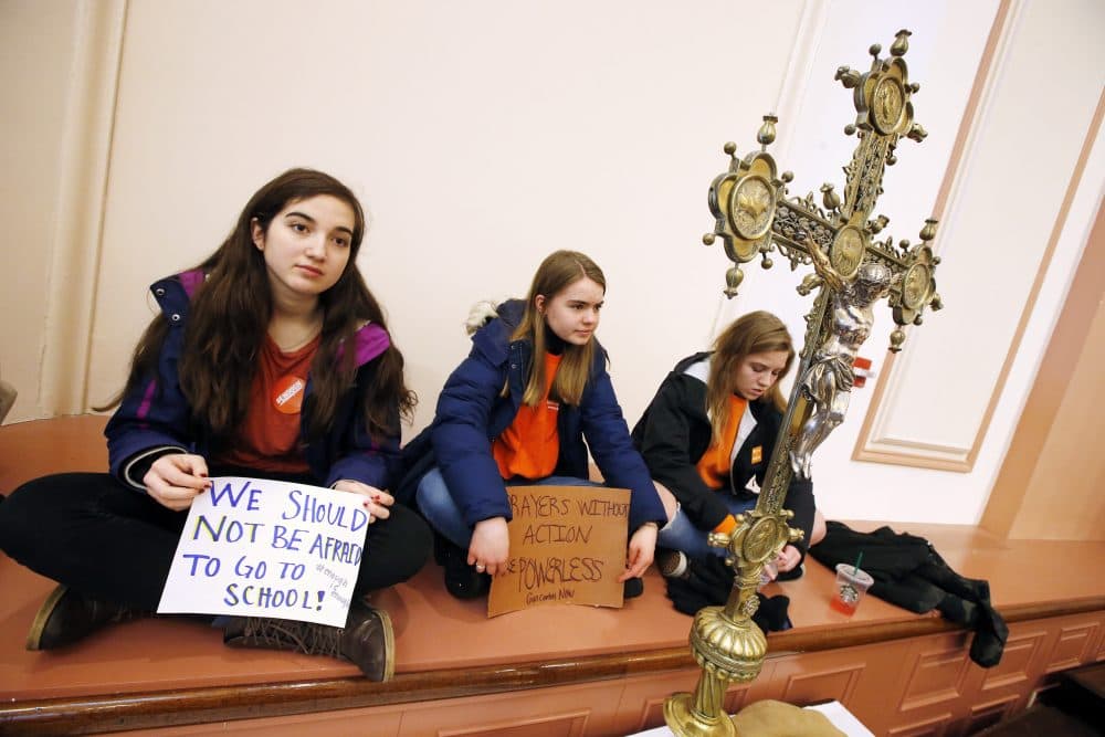 Boston-area highschoolers, from left, Cat Harris, 16, Molly O'Toole, 16, and Sarah von Schack, 15, listen to speeches inside St. Paul's Cathedral. (Michael Dwyer/AP)