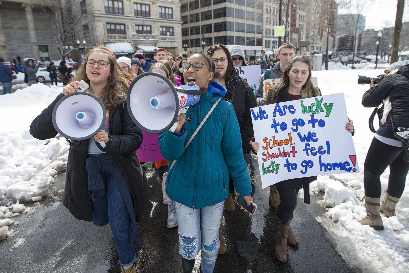 Students march across Boston Common from St. Paul's Cathedral tio the Massachusetts State House. (Jesse Costa/WBUR)