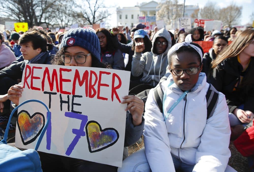 Students sit in silence as they rally in front of the White House in Washington on Wednesday. (Carolyn Kaster/AP)