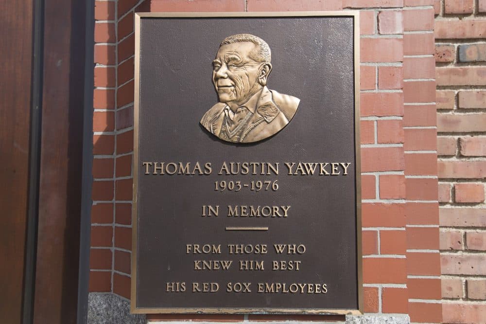 On the Fenway Park wall on Yawkey Way, a plaque is mounted honoring Thomas Yawkey. (Jesse Costa/WBUR)