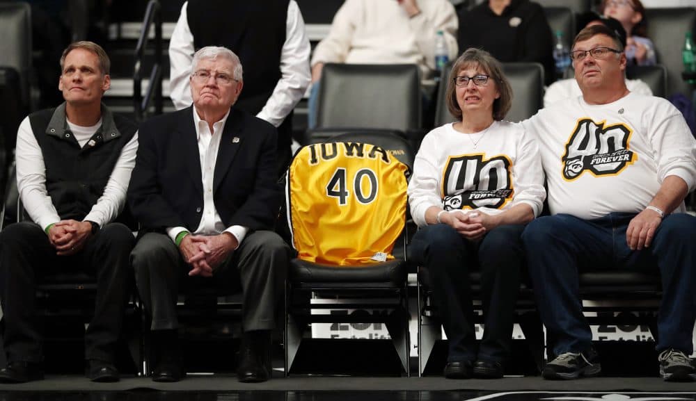 Patty and Mike Street, pictured here on the right at an Iowa-Purdue game in January, are the mother and father of Chris Street, whose school free throw record still stands. (Charlie Neibergall/AP)