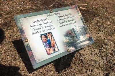 A plaque at the family gravesite in West Brookfield, Mass. Sara Bermudez and her children were interred together. (Shannon Dooling/WBUR)