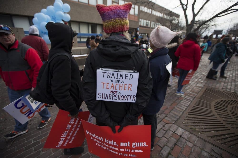 A sign on the back of a teacher at the March For Our Lives Rally in Boston. (Jesse Costa/WBUR)