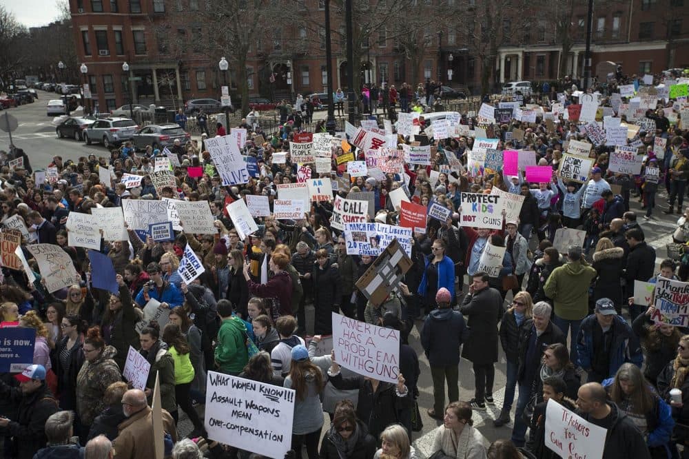 Protesters march down Columbus Ave toward Boston Common. (Jesse Costa/WBUR)
