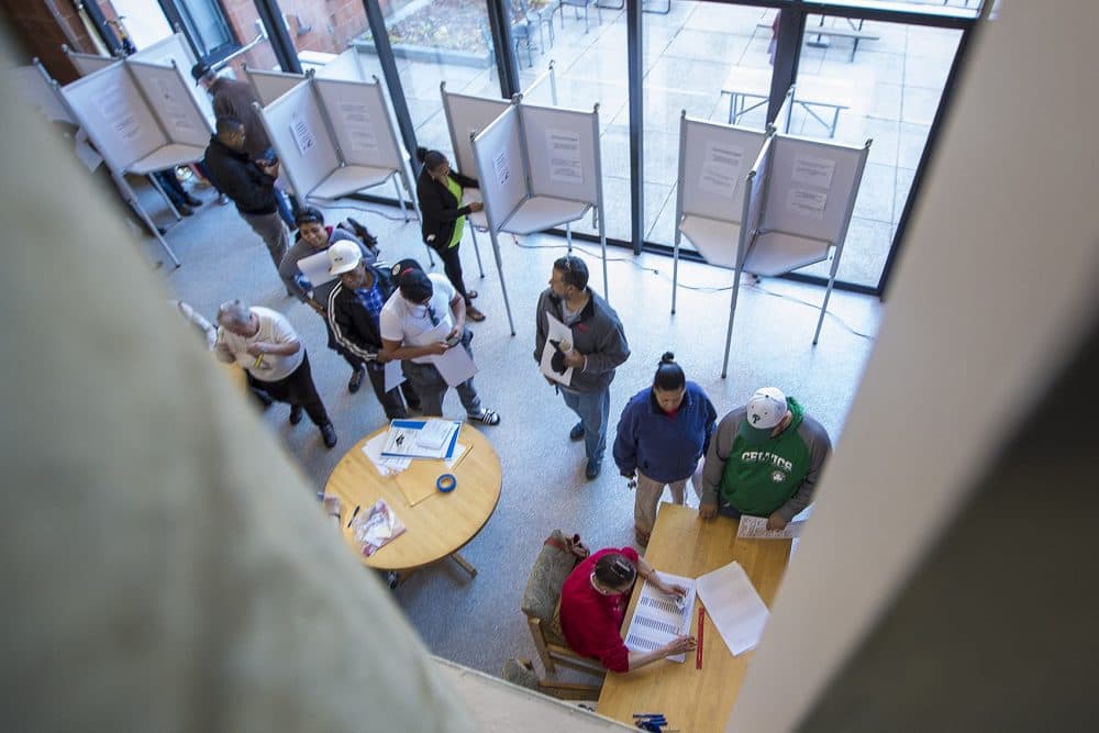 Voters line up to cast their ballots at the Valebrook Apartments in Lawrence. (Jesse Costa/WBUR)