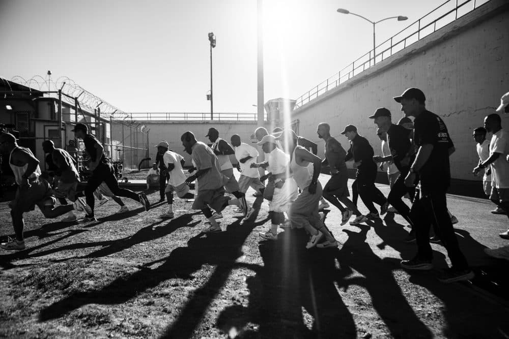 The 1,000 Mile Club at San Quentin Prison gives inmates the training to run 26.2 miles around a perimeter track of brick wall, a gun rail and barbed wire. (Jonath Mathew, Courtesy of 26.2 to Life)