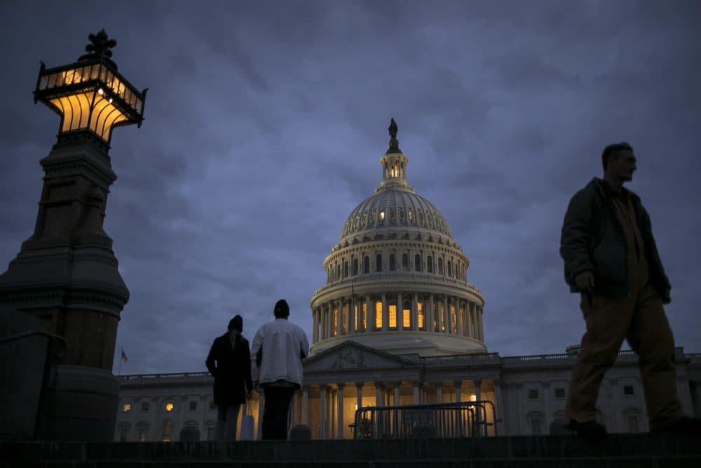 In this Jan. 21, 2018, file photo, lights illuminate the U.S. Capitol. (J. Scott Applewhite/AP)