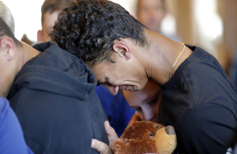Austin Burden, 17, cries on the shoulder of a friend after a vigil at the Parkland Baptist Church, for the victims of the shooting at Marjory Stoneman Douglas High School, in Parkland, Fla. (Gerald Herbert/AP)