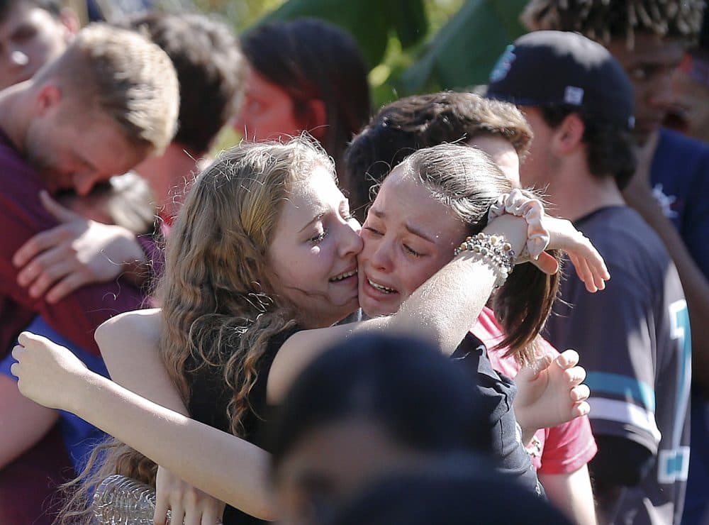 Students grieve at Pine Trails Park for the victims of the Wednesday shooting at Marjory Stoneman Douglas High School, in Parkland, Fla., Thursday, Feb. 15, 2018. (Brynn Anderson/AP)