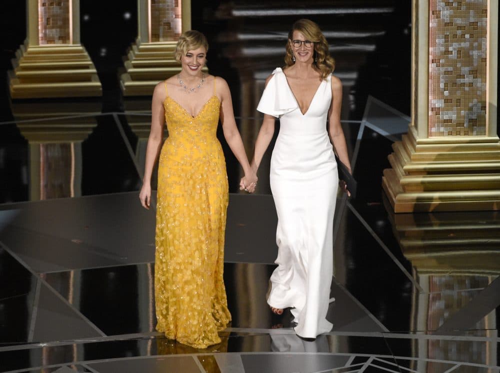 Greta Gerwig, left, and Laura Dern walk on stage to present the award for best documentary feature at the Oscars on Sunday, March 4, 2018, at the Dolby Theatre in Los Angeles. (Chris Pizzello/Invision/AP)