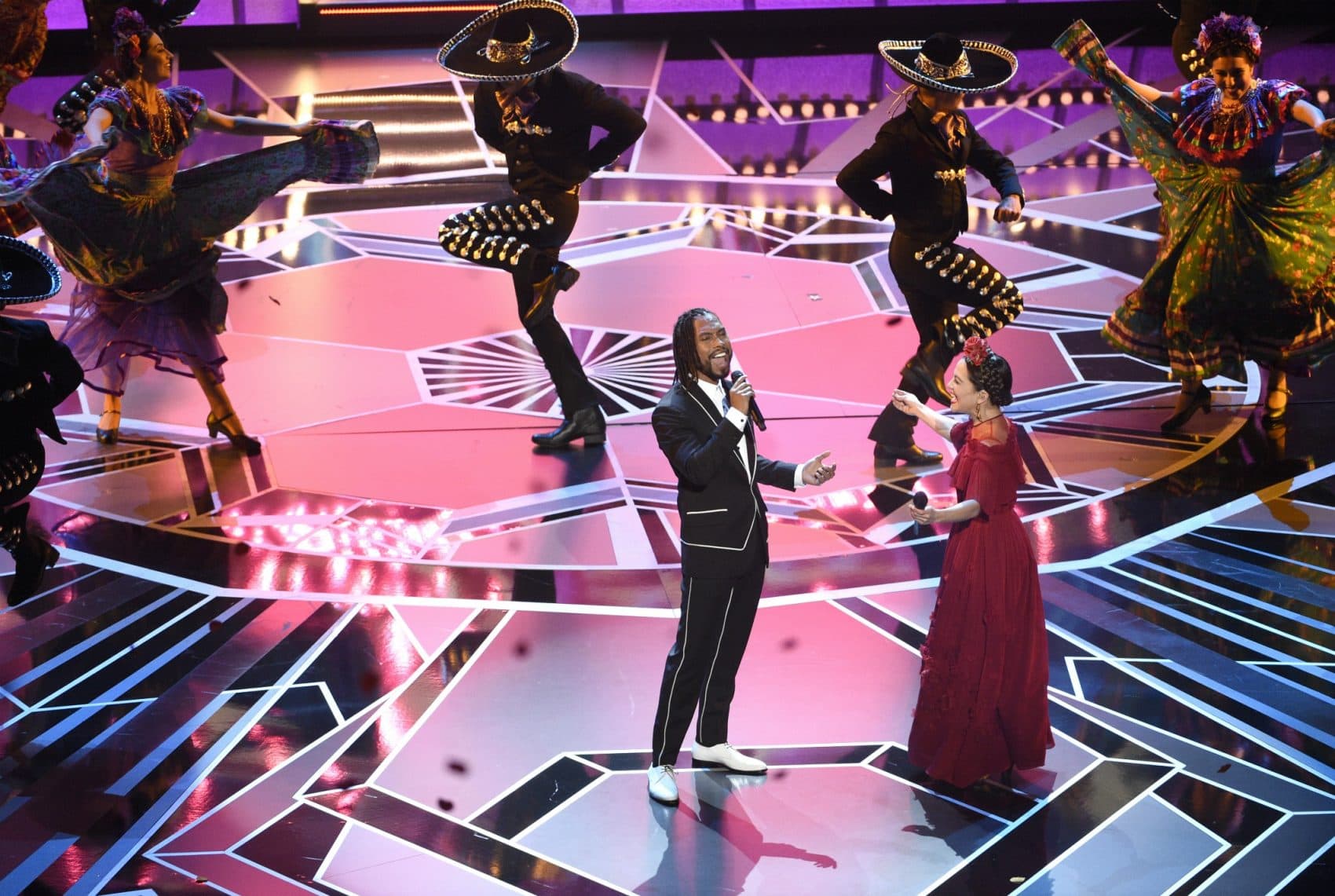 Miguel, left, and Natalia Lafourcade perform "Remember Me" from "Coco" at the Oscars on Sunday, March 4, 2018, at the Dolby Theatre in Los Angeles. (Chris Pizzello/Invision/AP)