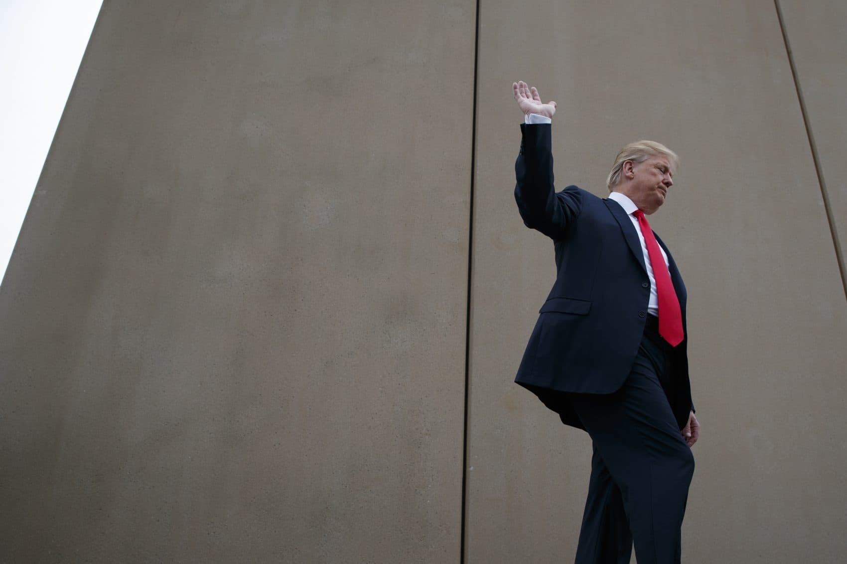 President Donald Trump talks with reporters as he gets a briefing on border wall prototypes, Tuesday, March 13, 2018, in San Diego. (Evan Vucci/AP)