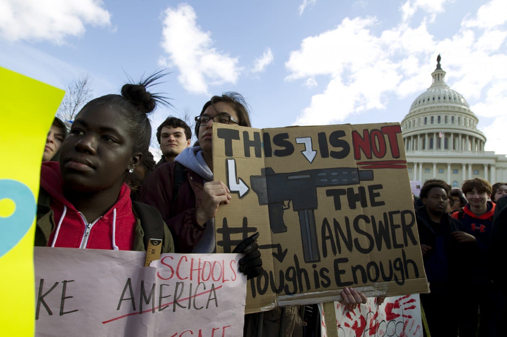 Students hold up their signs during a rally asking for gun control outside of the U.S. Capitol building, Wednesday, March 14, 2018, in Washington. (Jose Luis Magana/AP)