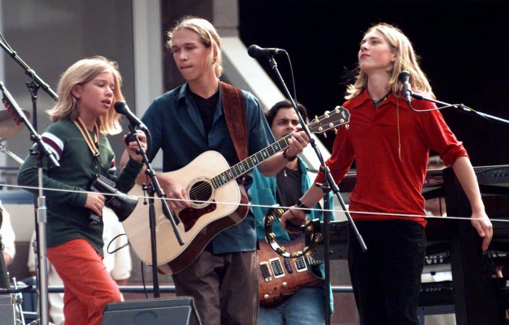 The Hanson Brothers perform in the new Arthur Ashe Stadium at the USTA National Tennis Center in New York on Aug. 23, 1997. (Adam Nadel/AP)