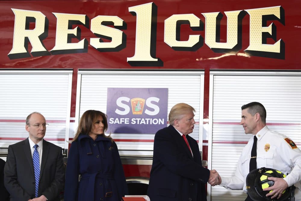 President Donald Trump shakes hands with Manchester City Fire Chief Daniel Goonan as first lady Melania Trump and Dr. William Goodman, Chief Medical Officer and Vice President of Medical Affairs for Catholic Medical Center watch during a visit to the Manchester Central Fire Station in Manchester, N.H., Monday, March 19, 2018. Trump is in New Hampshire to unveil more of his plan to combat the nation's opioid crisis. (AP Photo/Susan Walsh)