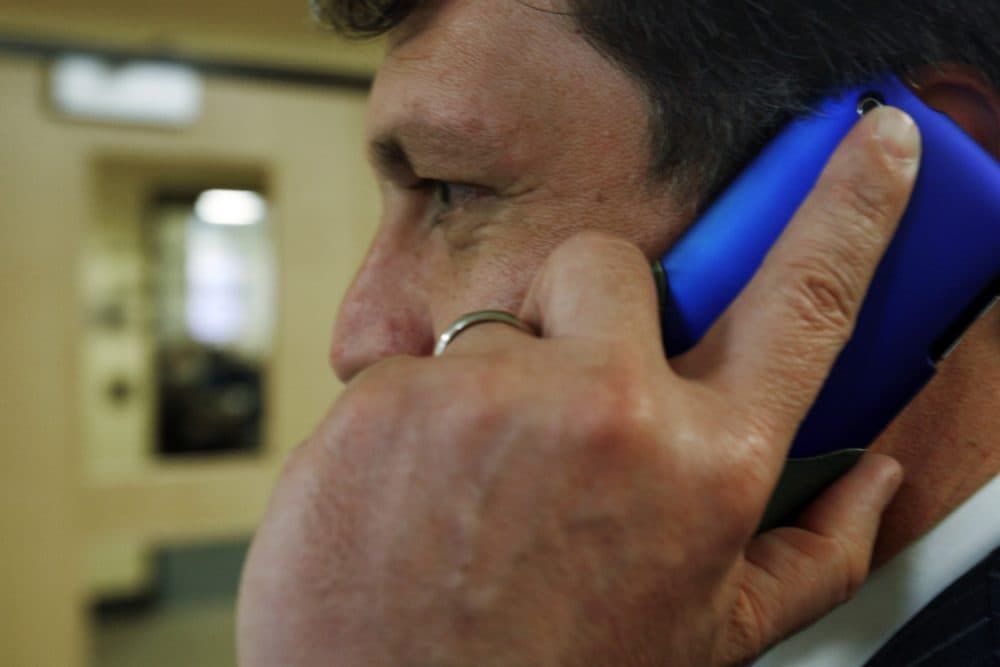 An unidentified man talks on his cell phone outside a hearing before the Legislature's Health and Human Services Committee concerning cell phone safety, in Augusta, Maine, on Tuesday, March 2, 2010. Supporters of a bill want to require cell phones in Maine to carry warnings that they may cause brain cancer. (Pat Wellenbach/AP)