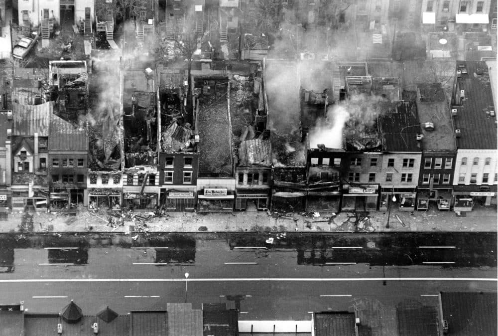 This aerial photo shows fire-gutted buildings, some still smouldering, along a block on H Street between 12th and 13th Streets in the northeast section of Washington, D.C. on April 5, 1968. Rioting broke out after the assassination of civil rights leader Dr. Martin Luther King, Jr., in Memphis, Tenn. on April 4. (AP)