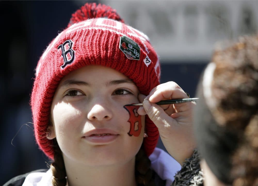 Lilly Beasley, 13, of Valley Springs, Calif., has a &quot;B&quot; painted on her face outside Fenway Park before the home opener baseball game between the Boston Red Sox and the Tampa Bay Rays. (Steven Senne/AP)