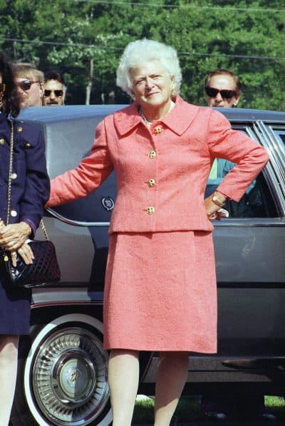 First Lady Barbara Bush reacts as she waits for her husband, President George H. W. Bush, near the presidential motorcade just prior to departing their vacation compound in Kennebunkport, Maine. (Greg Gibson/AP)