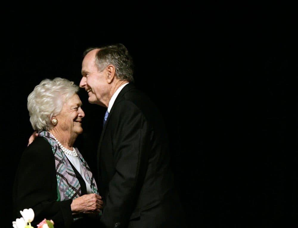 Former President George H.W. Bush, embraces former first lady Barbara Bush at the Genesis Women's Shelter Mother's Day Luncheon in 2006. (Tony Gutierrez/AP)