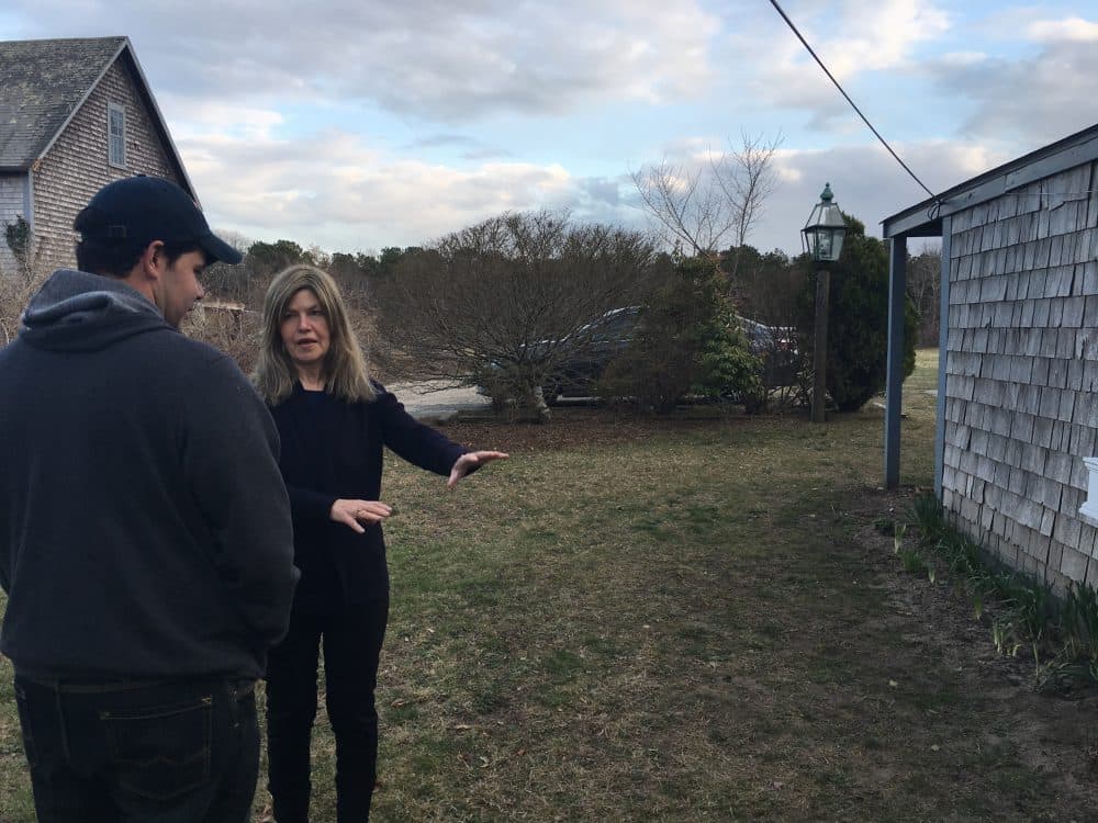 Wescley Pereira and Gail Meister chat about a yard project. The two have been neighbors on Martha’s Vineyard for more than a decade. (Shannon Dooling/WBUR)