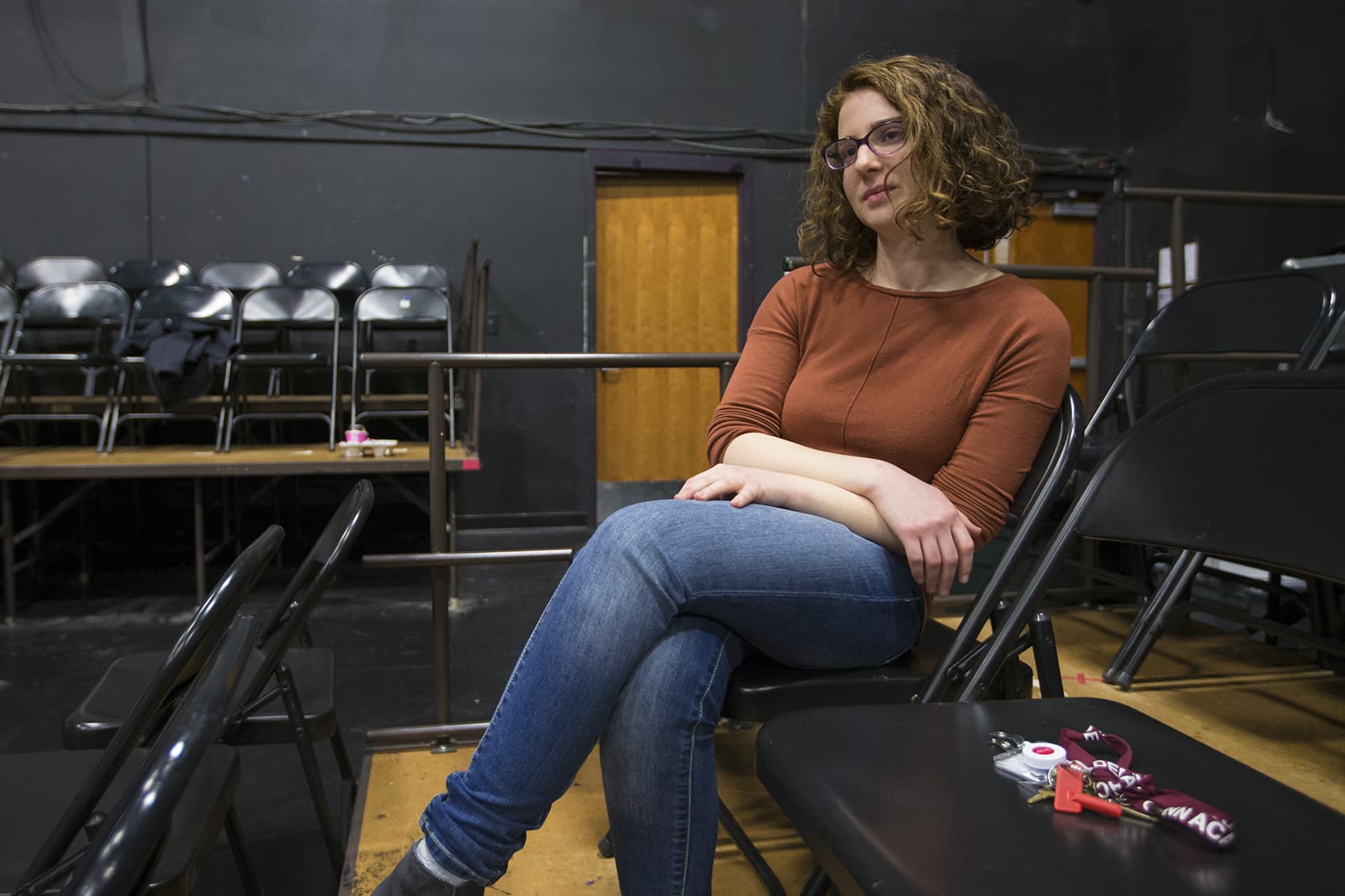 Teacher Lynda Bachman watches as her students rehearse at the Gann Academy. (Jesse Costa/WBUR)