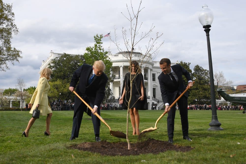 President Trump and first lady Melania Trump participate in a tree-planting ceremony with French President Emmanuel Macron and his wife Brigitte Macron on the South Lawn of the White House in Washington, D.C., on April 23, 2018. (Jim Watson/AFP/Getty Images)