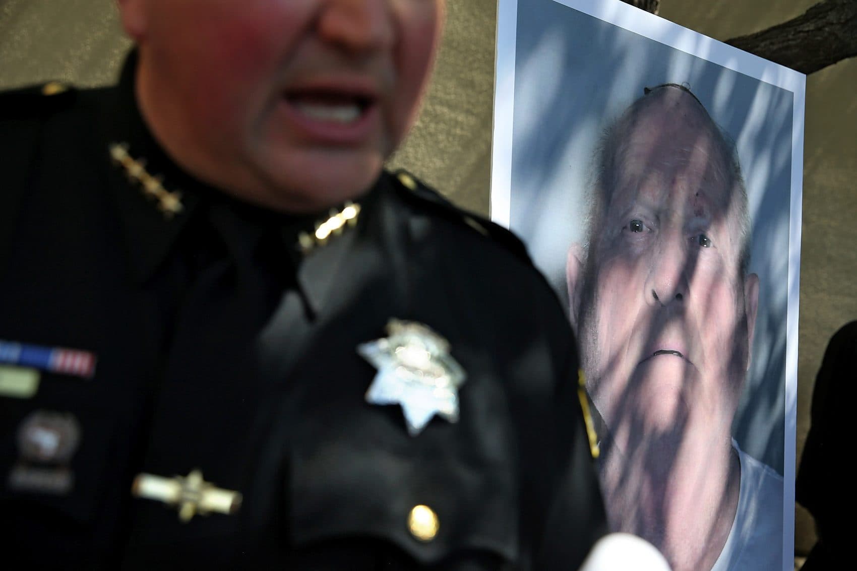 A photo of accused rapist and killer Joseph James DeAngelo is displayed during a news conference on April 24, 2018 in Sacramento, Calif. Sacramento District Attorney Anne Marie Schubert was joined by law enforcement officials from across California to announce the arrest of the 72-year-old DeAngelo, who is believed to be the "Golden State Killer" who killed at least 12, raped over 45 people and burglarized hundreds of homes throughout California in the 1970s and '80s. (Justin Sullivan/Getty Images)