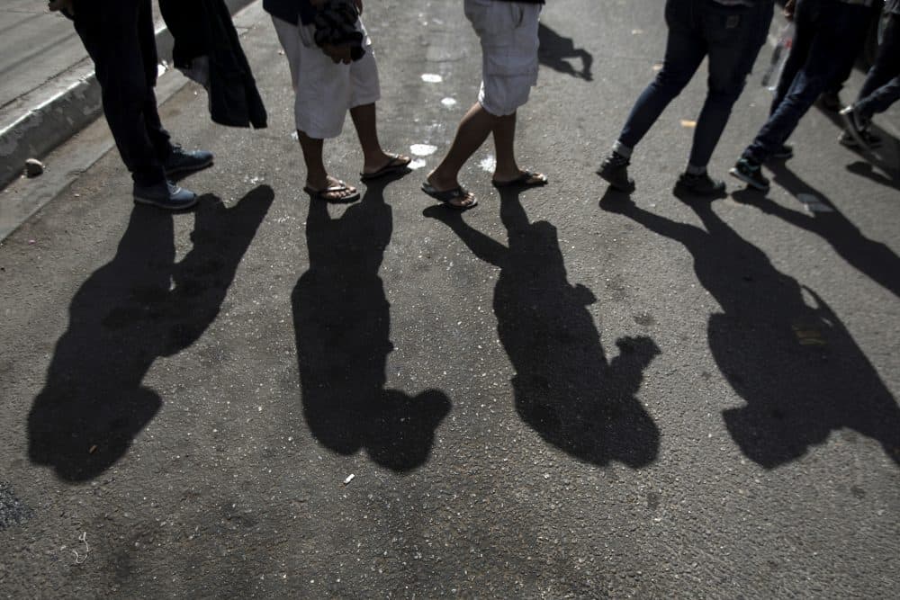 Migrants in a caravan of Central American asylum-seekers board a bus in Mexicali, Mexico, Thursday, April 26, 2018, for a two-hour drive to Tijuana to join up with about 175 others who already arrived. Lawyers planned free workshops on the U.S. immigration system on Friday and Saturday as many planned to seek asylum starting Sunday at San Diego's San Ysidro border crossing, the nation's busiest. (Hans-Maximo Musielik/AP)