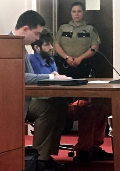 John Williams, center, accused in the fatal shooting of Somerset County Sheriff&#039;s Deputy Eugene Cole, sits with an attorney during his initial court appearance on a murder charge on Monday. He was ordered held without bail. (Marina Villeneuve/AP)