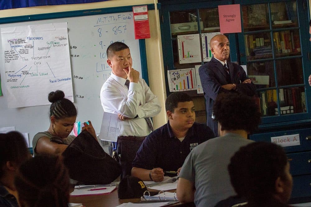 Boston Schools Superintendent Tommy Chang observes a class at the Boston International High School. (Jesse Costa/WBUR)