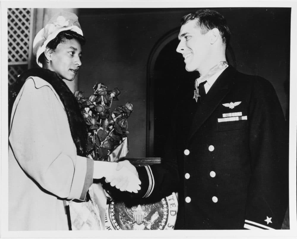 Hudner is congratulated by Daisy Brown, widow of Ensign Jesse Brown, after he received the Medal of Honor from President Truman at the White House on April 13, 1951. (Courtesy U.S. Navy)