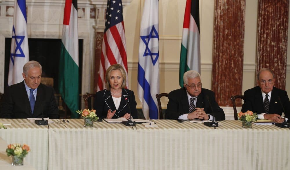 Former Secretary of State Hillary Clinton is seated with (left to right) Israeli Prime Minister Benjamin Netanyahu, Palestinian President Mahmoud Abbas and former Special Envoy for Middle East Peace George Mitchell as she hosts the relaunch of direct negotiations at the State Department in Washington, Thursday, Sept. 2, 2010. (Charles Dharapak/AP)