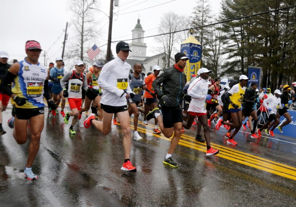 The elite men runners break from the starting line. (Mary Schwalm/AP)