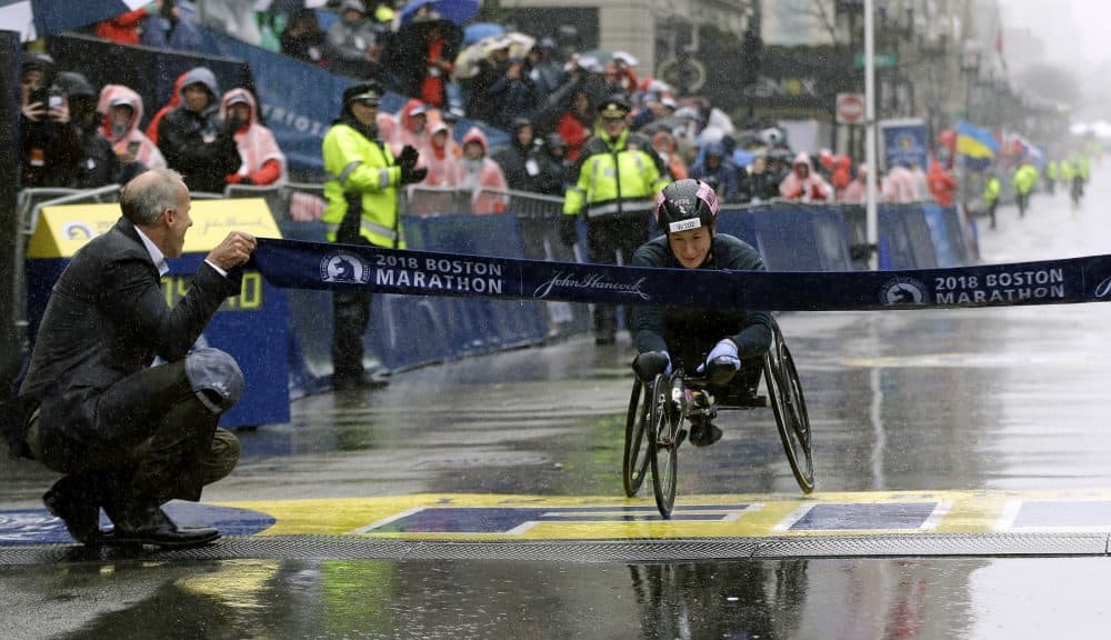 Tatyana McFadden, of the United States, crosses the finish line to win the women's wheelchair division. (Elise Amendola/AP)
