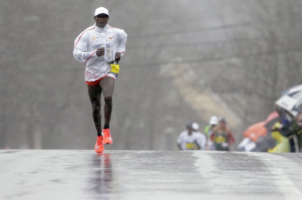 Geoffrey Kirui, of Kenya, separates himself from the pack in the men's elite division in Newton. (Steven Senne/AP)