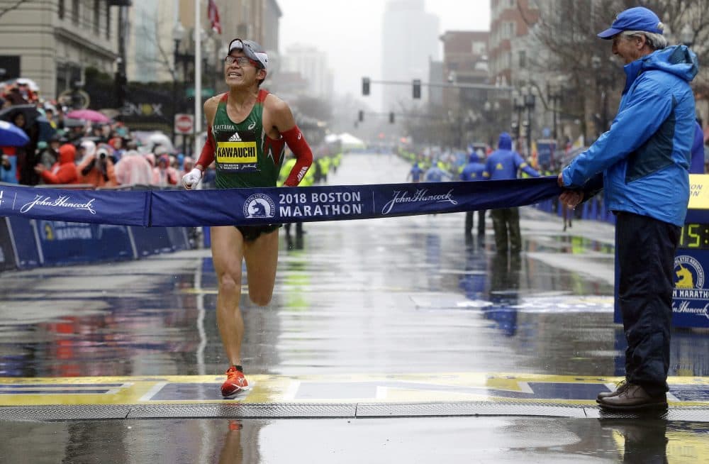 Yuki Kawauchi, of Japan, overtook Geoffrey Kirui, of Kenya, to win the 122nd Boston Marathon. He is the first Japanese man to win the race since 1987. (Elise Amendola/AP)